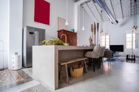 Interior of loft apartment with refrigerator