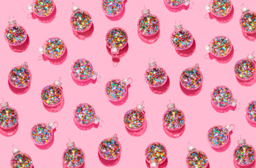 Bright balls for Christmas tree pattern on pink background
