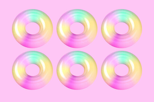 Three dimensional render of colorful doughnuts against pink background