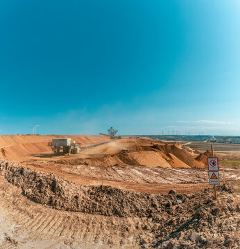 Clear blue sky over open-pit mine