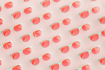 Three dimensional pattern of rows of pink sunglasses