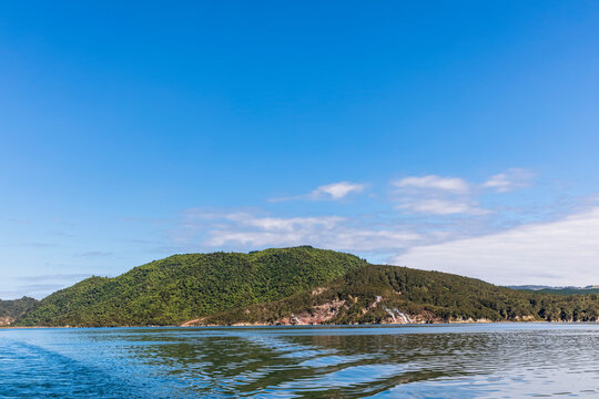 Hilly island covered with forest