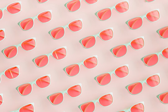 Three dimensional pattern of rows of pink sunglasses
