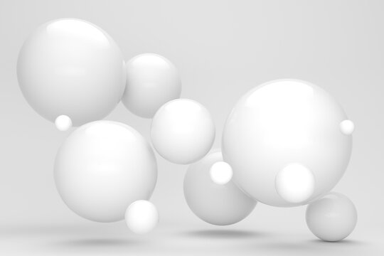 Three dimensional render of white floating spheres