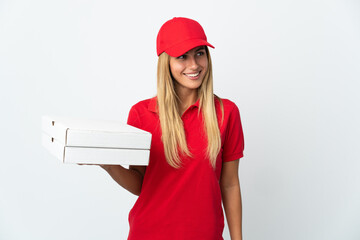 Pizza delivery woman holding a pizza isolated on white background looking side