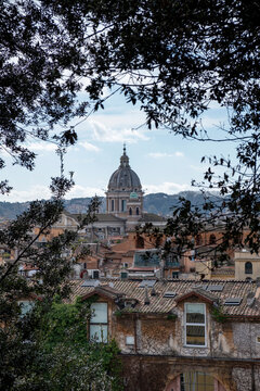 Italy, Rome, Old town houses with San Carlo al Corso church in background