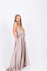 young girl in white wedding dress dancing on white background