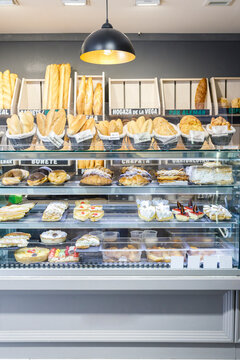 Various Pastry Items In Display Cabinet At Bakery