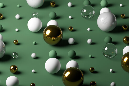 Gold, glass, marble spheres against pastel green background