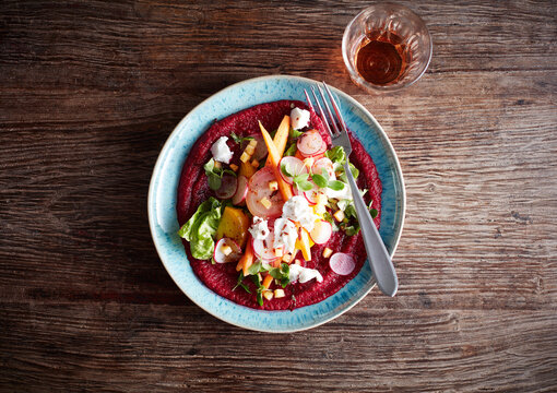 Beetroot puree with goat cheese, lettuce, radishes and pumpkin seeds