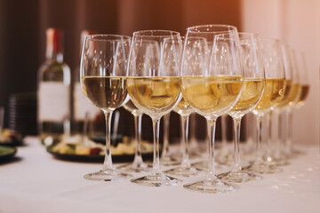 Rows of glasses with alcohol on degustation 