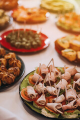 Naklejka na ściany i meble Delicacies and snacks on a buffet or banquet. Catering.