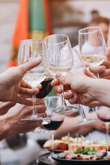 Group of people cheering with wine