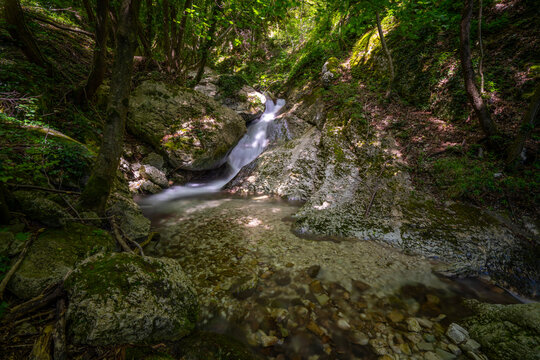 Long exposure of river flowing in Monte Cucco Park, Umbria, Italy