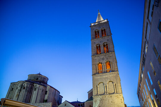 Croatia, Zadar County, Zadar, Bell tower of Zadar Cathedral at dusk with&nbsp;Church of Saint Donatus in background