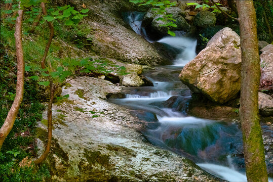 Long exposure of river flowing in Monte Cucco Park, Umbria, Italy
