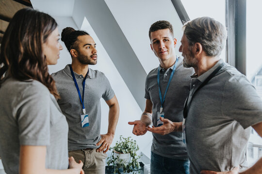 Male and female professionals discussing during conference