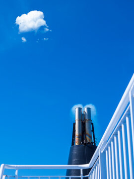 Smoke emitting from chimneys of ferry