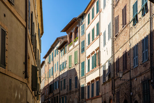 Italy, Tuscany, Siena, Row of historic townhouses