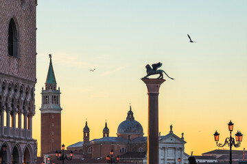 Italy, Veneto, Venice, Lion of Venice column at dusk with Church of San Giorgio Maggiore in background