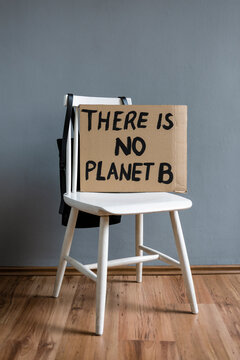Western script on cardboard over wooden chair in studio