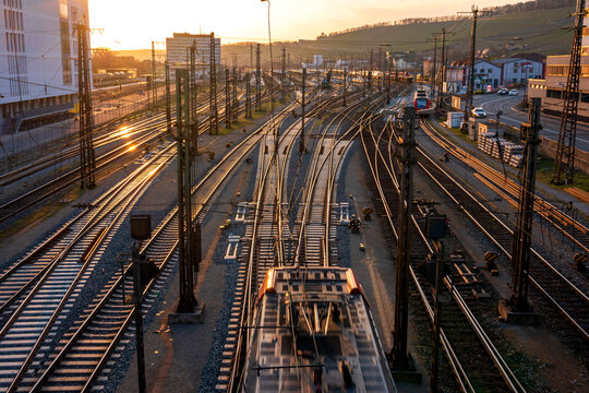 Germany, Bavaria, Wurzburg, Empty railroad tracks at sunset