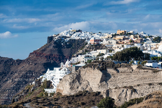Greece, Santorini, Fira, White-washed houses of town situated at edge of coastal caldera