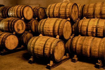 Wine barrels on old cellar. Warm and desaturated tones