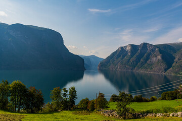 Norway, Aurland, Mountains reflecting in tranquil waters of Aurlandsfjord