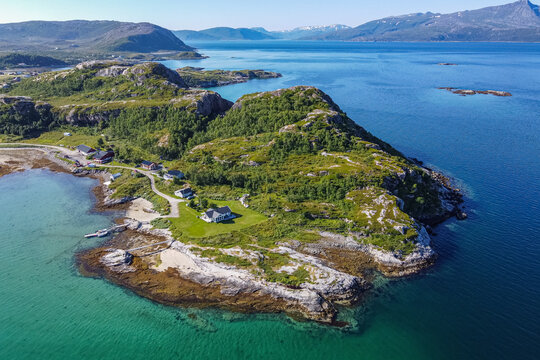 Norway, Troms og Finnmark, Brensholmen, Aerial view of small coastal settlement on Senja island