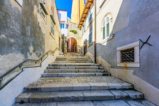 Narrow alley with stone stairs at Rovinj, Istria, Croatia