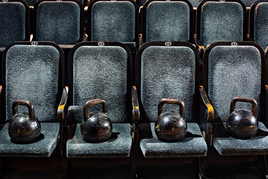 Kettlebells lying on seats in empty theater