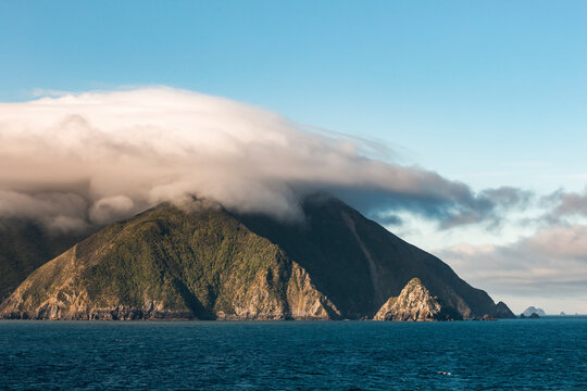 Thick clouds shrouding coastal mountains of Marlborough Sounds