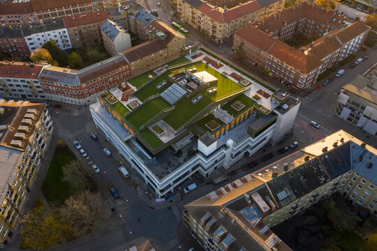 Sweden, Scania, Malmo, Aerial view of rooftop lawn in middle of residential city district