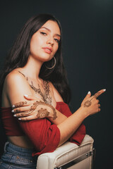 Portrait of a girl tattooed with hindu henna
