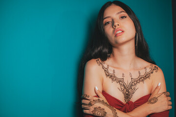 Portrait of a girl tattooed with hindu henna