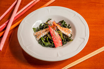 Wakame seaweed salad with surimi and scampi