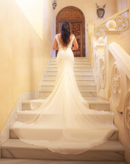 Bride Walking Up Elegant Staircase in Long White Dress — Wedding Moment
