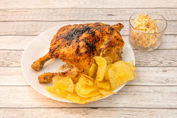 Grilled whole chicken with French fries chips and coleslaw