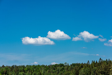 Picturesque clouds in a clear blue sky.