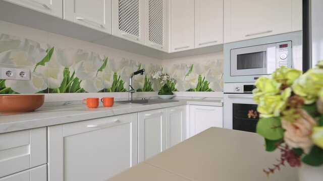 White moden classic kitchen with dining table