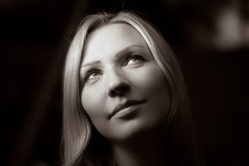 Black and white close-up portrait of young beautiful woman