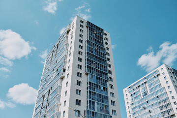 part of typical high-rise building against the gray sky. Copy space image. Residential complex Sportivnaya station of Suvarstroit Development in City of Kazan