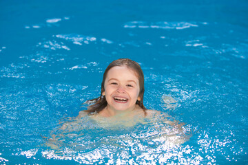 Fototapeta na wymiar Funny child face. Kids in swimming pool. Kid relax in poolside.