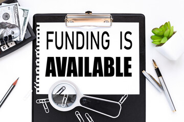 FUNDING IS AVAILABLE. text on a white sheet of paper near a magnifying glass m flowerpot in a pot