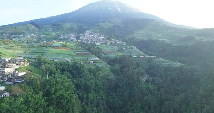Aerial footage of Dusun Butuh Nepal Van Java vegetable plantation on slope of the Mount Sumbing. Perfect for cinematic, travel, promotion and documentaries video