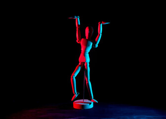 Wooden stick man toy with dark background, arms raised, retrowave style