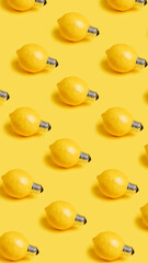 Pattern with fresh lemons as bulbs isolated on a yellow background. Creative food recipe idea. Abstract and surreal fruit health diet concept. Flat lay, top view.