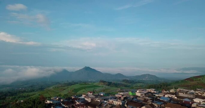 Aerial footage of Dusun Butuh Nepal Van Java vegetable plantation on slope of the Mount Sumbing. Perfect for cinematic, travel, promotion and documentaries video