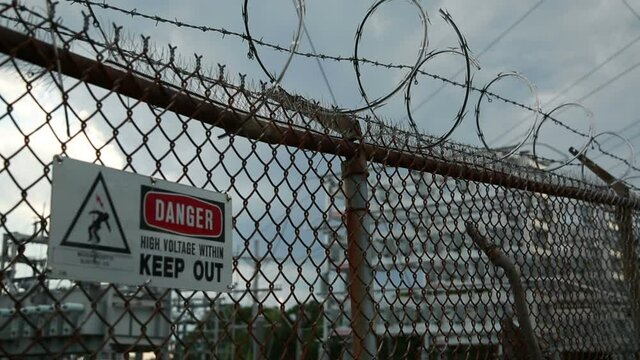 danger high voltage fence barbed wire